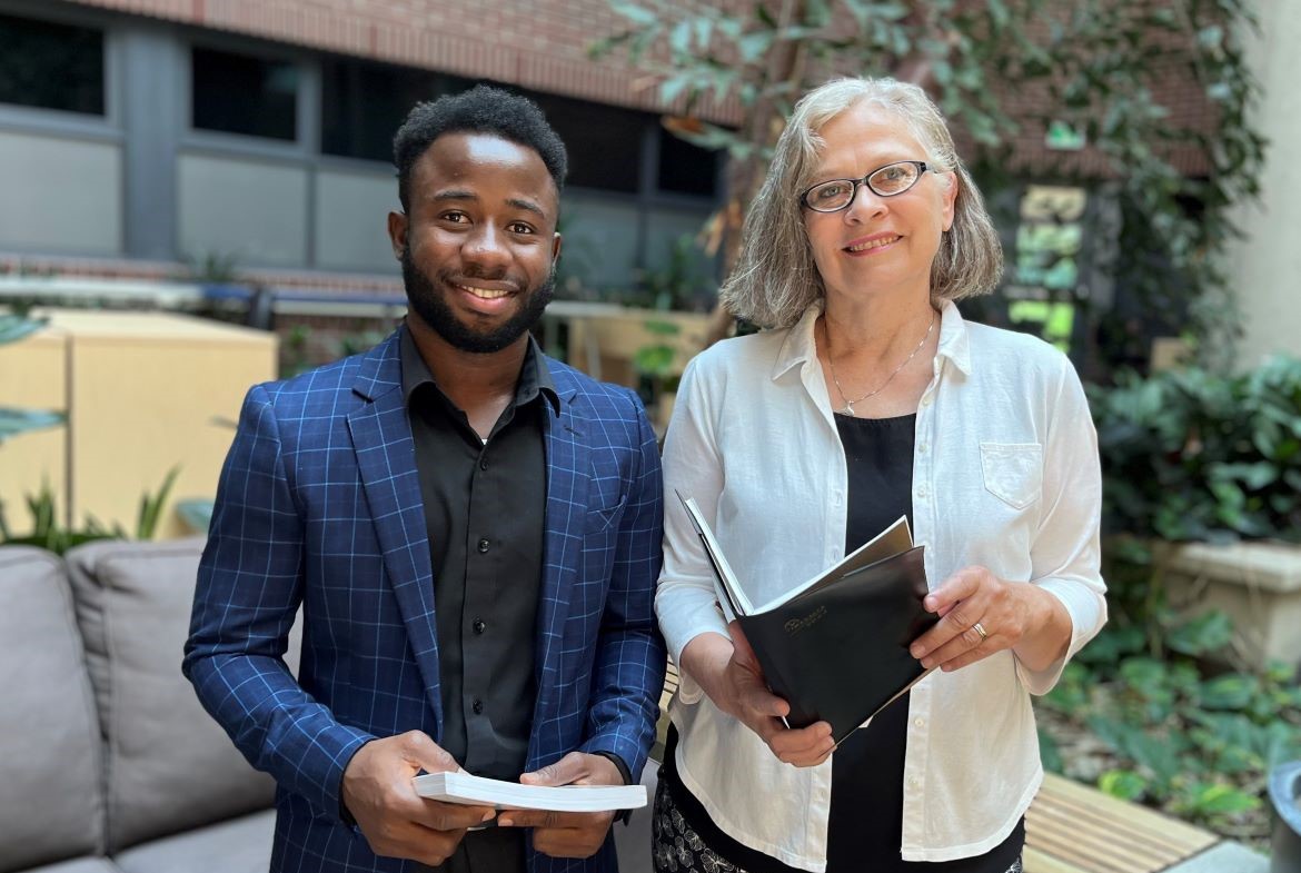 MSN student Ali Bawamia and Dr. Lise Olsen standing together.